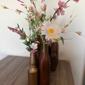 Wildflower floral arrangements and bottles